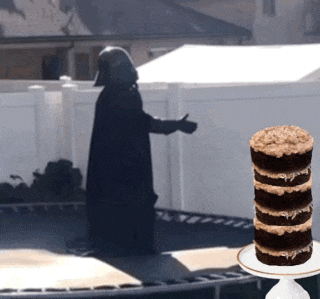 darth vader is standing on a trampoline next to a stack of cookies