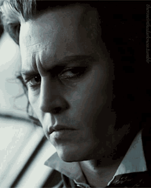 a close up of a man 's face with the word tumblr written below it