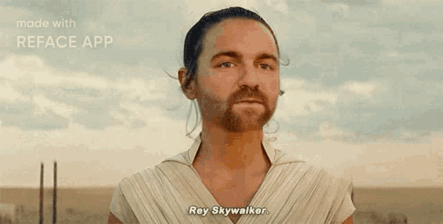 a man with a beard is wearing a white shirt and saying rey skywalker .