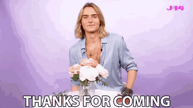 a man holding a bouquet of flowers with the words thanks for coming below him