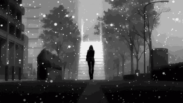 a black and white photo of a woman walking down stairs