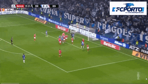 a soccer game between fc porto and sl benfica is shown on a screen