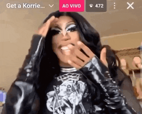 a drag queen is making a funny face during a live stream .