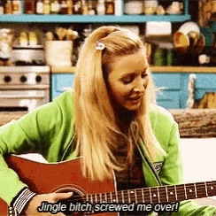 a woman singing while playing a guitar with the words jingle bitch screwed me over