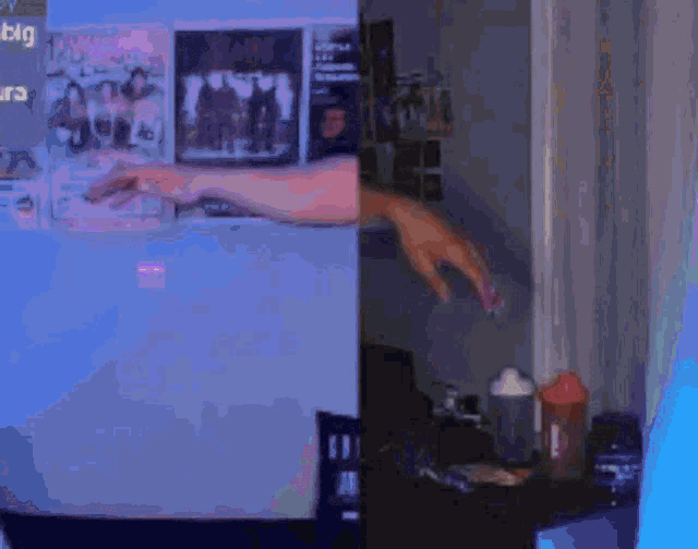 a blurred image of a room with posters on the wall including one that says big