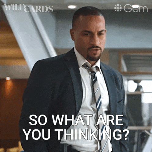 a picture of a man in a suit and tie with the caption so what are you thinking