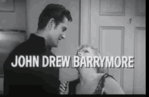 a black and white photo of a man and a woman with the name john drew barrymore on the bottom
