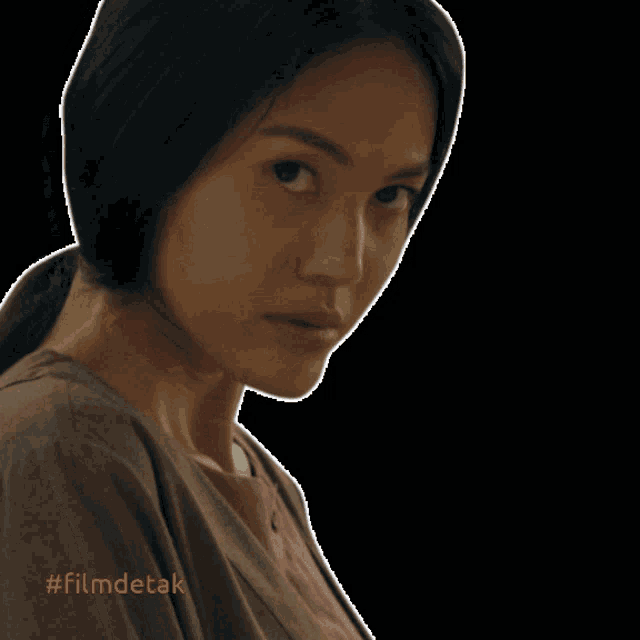a picture of a woman with the words maaf aku