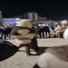 a man in a shrek costume is walking through a crowd