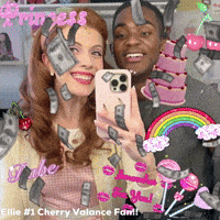 a man and a woman taking a selfie with money falling on them