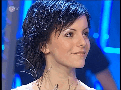 a close up of a woman 's face with 2df written on the bottom