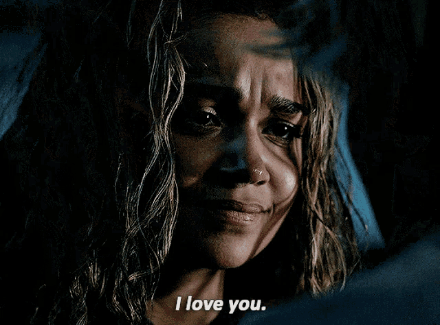 a close up of a man 's face with the words " i love you too " visible