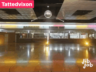 a disco ball hangs from the ceiling above an empty roller rink called tattedvixon