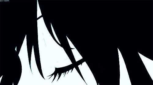a close up of a person 's eye with a dark background