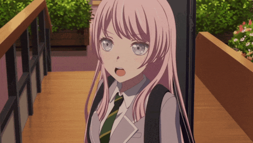 a girl with pink hair is wearing a green and white tie