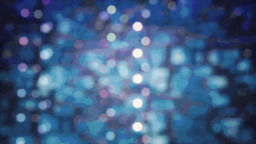 a blurry picture of a blue background with white circles on it