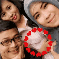 a group of people are posing for a picture with hearts around their faces