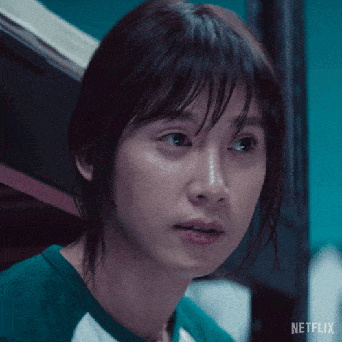 a close up of a woman 's face with netflix written on the bottom right