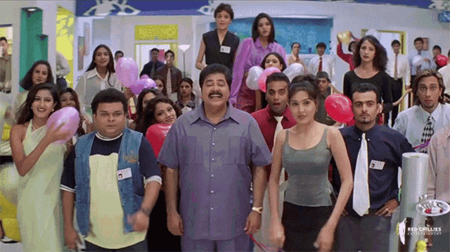 a group of people holding balloons and a man with a name tag that says ' ram '