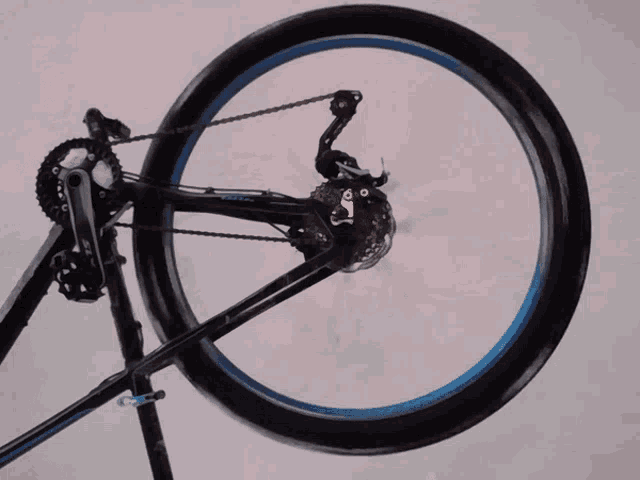 a bicycle with a blue tire and a chain