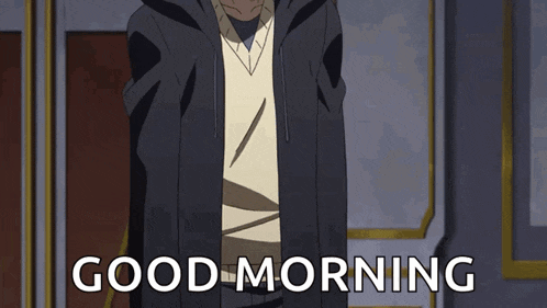 a man in a black jacket is standing in front of a door and says good morning .