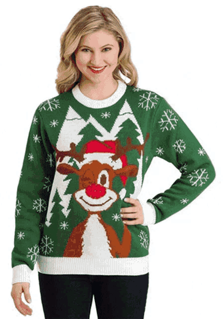 a woman is wearing a green christmas sweater with a reindeer on it