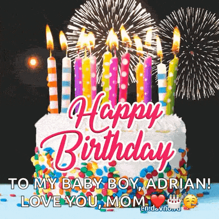 a birthday cake with candles and fireworks in the background and the words `` happy birthday to my baby boy adrian ! love you mom ''