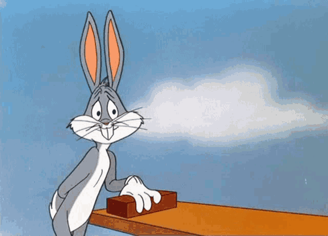 a cartoon character named bugs bunny is pressing a button