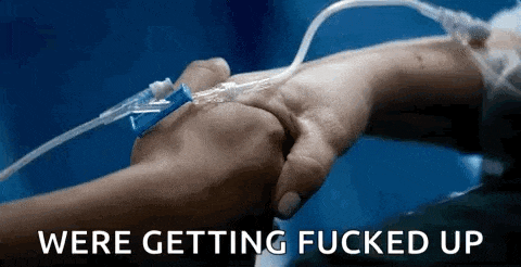 a person is holding another person 's hand with an iv in it and the words `` we 're getting fucked up ''