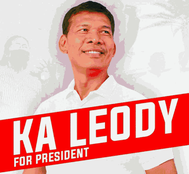 a man in a white shirt is standing in front of a sign that reads ka leody for president