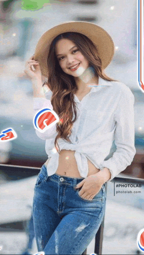a woman wearing a straw hat and a white shirt is standing in front of a photolab sign