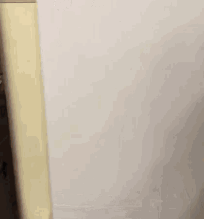 a white foam mattress is sitting on top of a white table .