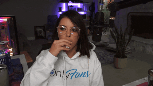 a woman wearing glasses and a white hoodie that says only fans
