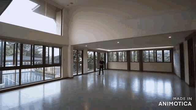 a large empty room with the words made in animotica on the bottom right