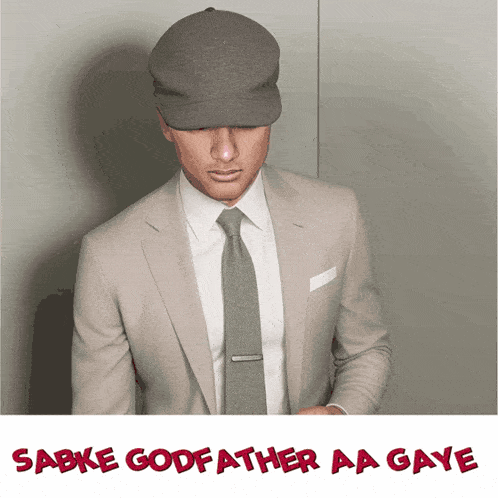 a picture of a man in a suit and tie with the words sabke godfather aa gaye below him