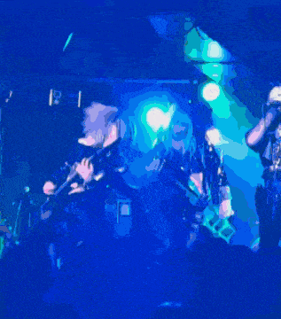 a group of people playing instruments on a stage with a sign that says u.s.