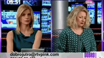 two female news anchors are sitting at a desk in front of a sign that says dobro