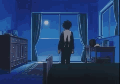 a bedroom with a full moon shining through the windows