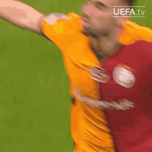 a close up of a soccer player 's shirt with the uefa tv logo in the corner