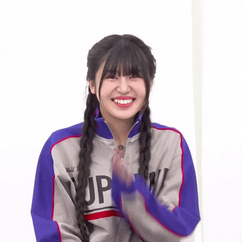 a girl wearing a supreme jacket smiles for the camera