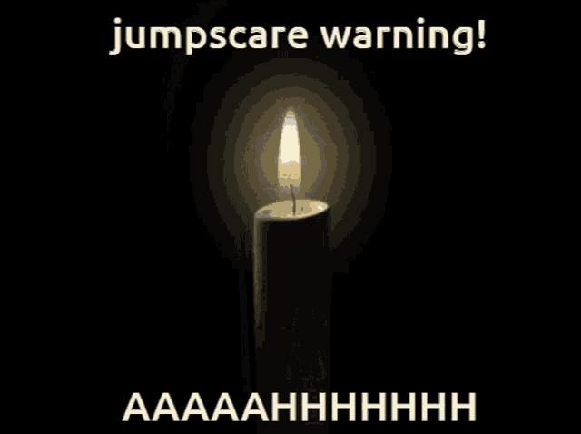 a picture of a lit candle with the words jumpscare warning written above it
