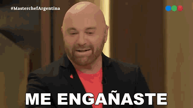 a bald man with a red shirt says me enganaste in spanish