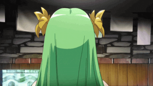 a girl with green hair and yellow flowers in her hair stands in front of a brick wall