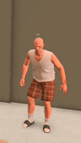 a bald man wearing plaid shorts and a white tank top is standing in a room .