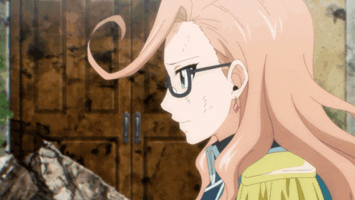 a girl with long hair and glasses is standing in front of a brown door