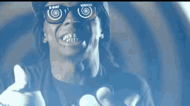 a man wearing sunglasses that say x-ray vision