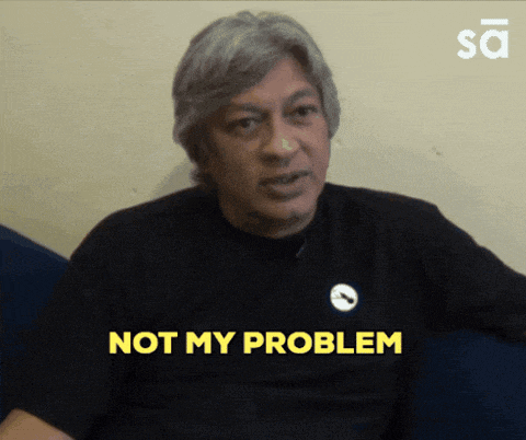 a man in a black shirt says " not my problem " in yellow letters