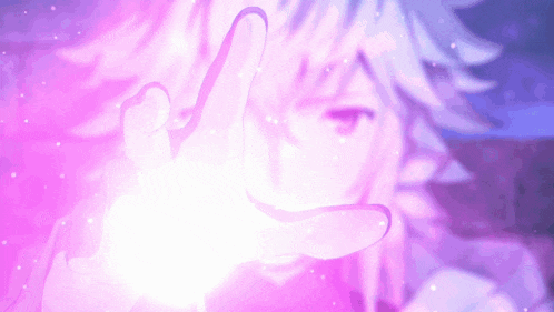 a person 's hand is reaching out towards a pink light
