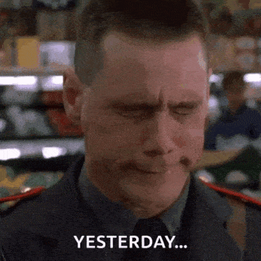a man in a police uniform is crying in a grocery store and saying `` yesterday '' .