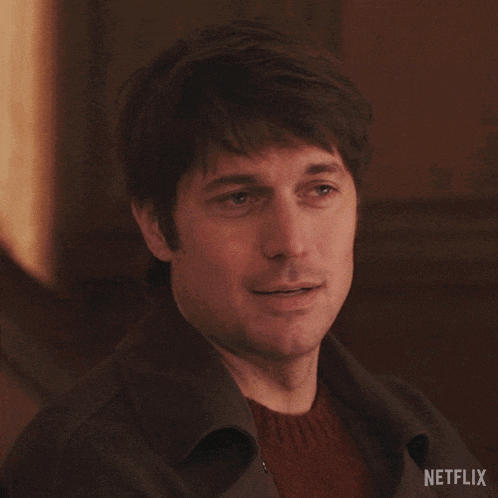 a close up of a man 's face with netflix written on the bottom right